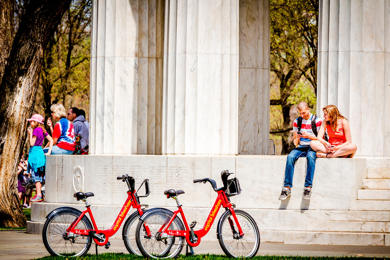 Couple with Capital Bikeshare Bikes at DC War Memorial - Washington, DC