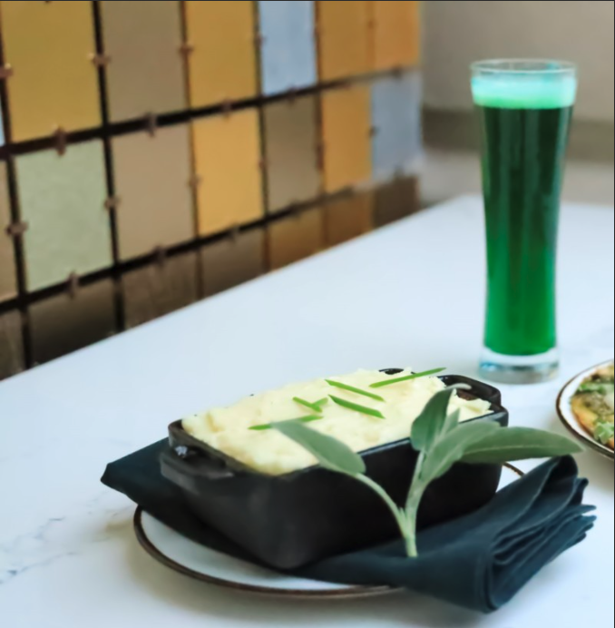 Green beer and a plate of Irish food