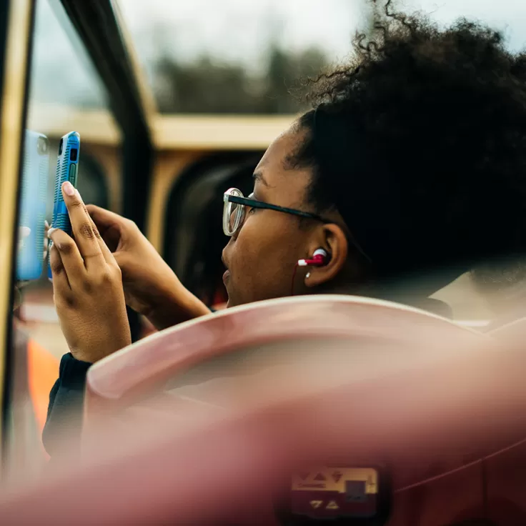 Student taking photo on Big Bus Tour